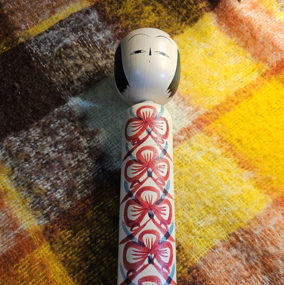 Handcrafted Signed Kokeshi Doll with Red Floral Design - Picture 2 of 5